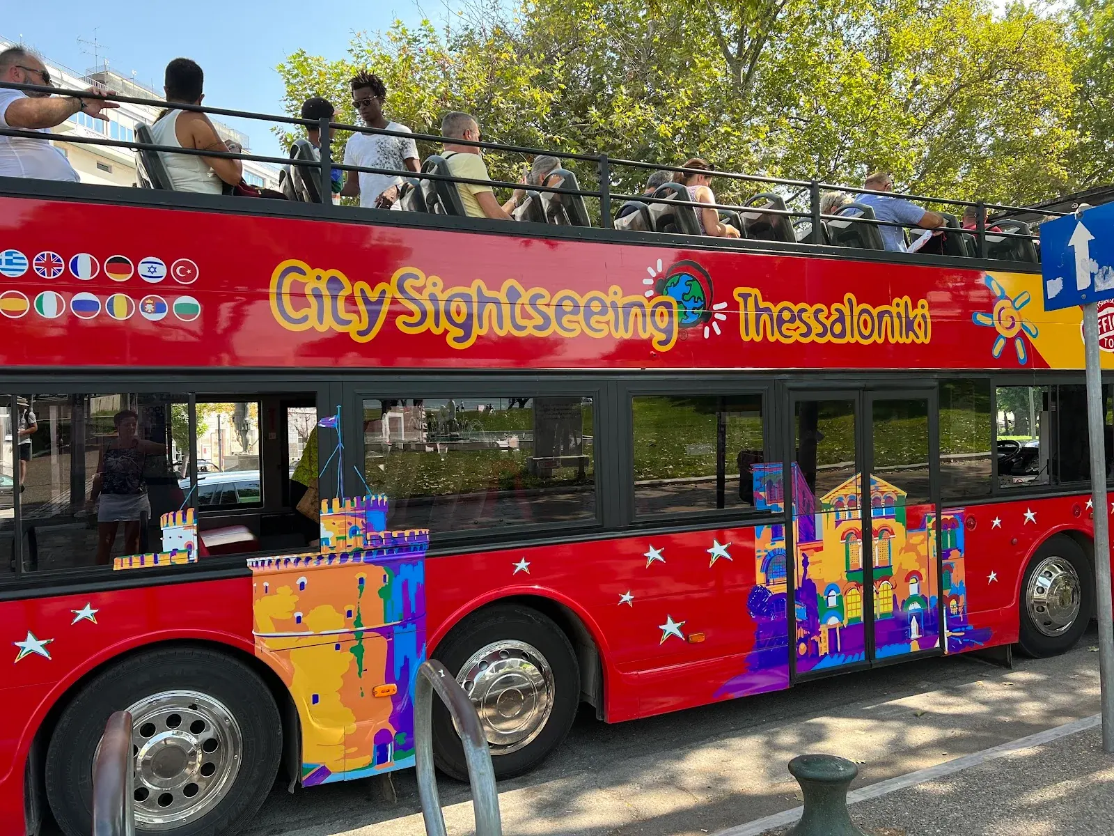 The red City Sightseeing Thessaloniki open-top double-decker bus