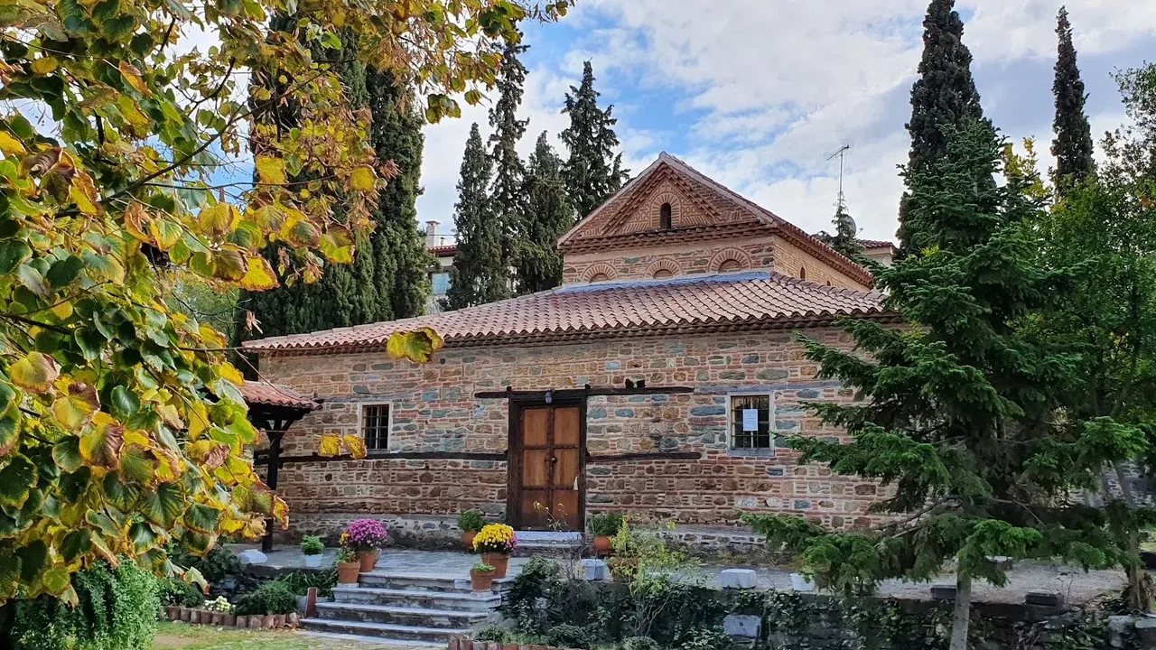 The stone-built Byzantine church of Agios Nikolaos Orfanos in Thessaloniki, surrounded by autumn trees