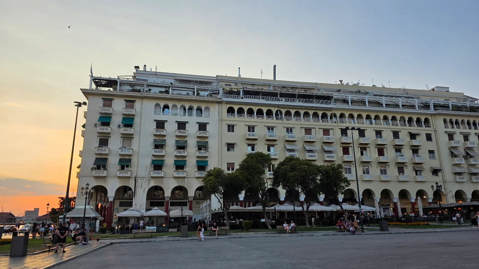 The arcaded Electra Palace facade on Aristotelous Square at sunset, Thessaloniki