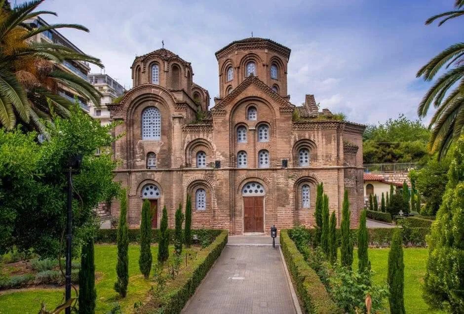 The red-brick Byzantine church of Panagia Chalkeon (1028), the 'Red Church', framed by a cypress garden in central Thessaloniki