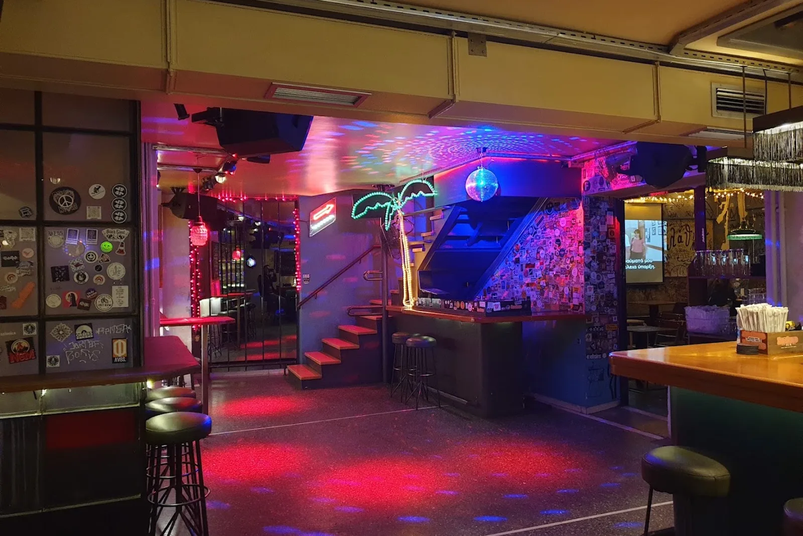 Warmly lit cocktail bar interior at La Doze in the Valaoritou district of Thessaloniki
