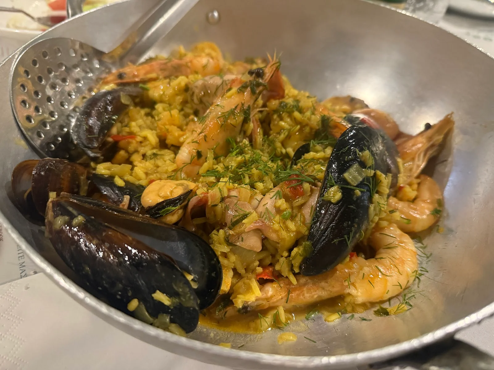 A pan of seafood rice with mussels and prawns at Ouzerie Lola, Thessaloniki