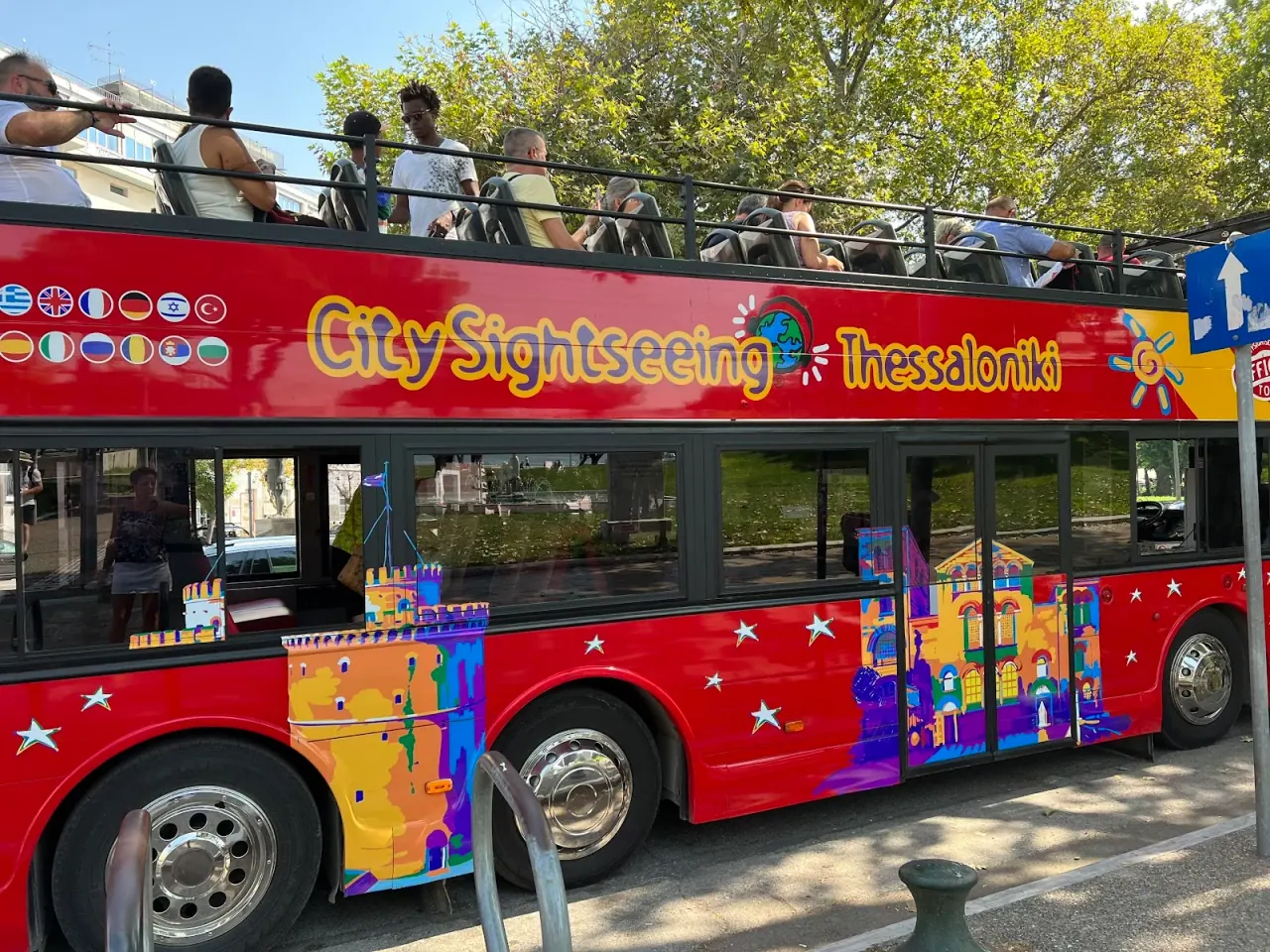 The red City Sightseeing Thessaloniki open-top double-decker bus