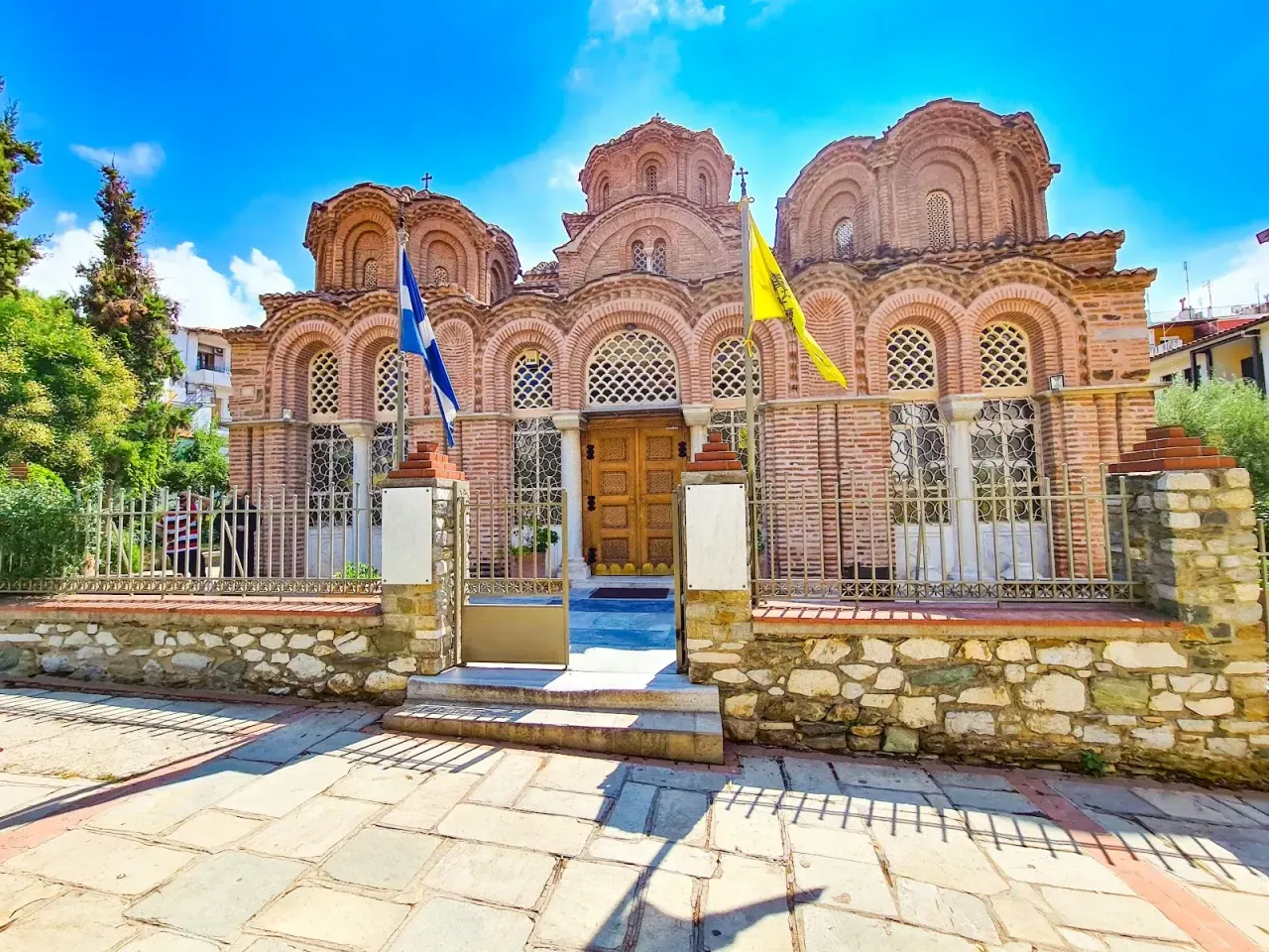The five-domed brick exterior of the Byzantine church of Agia Aikaterini in Ano Poli, Thessaloniki, with its arcaded gallery