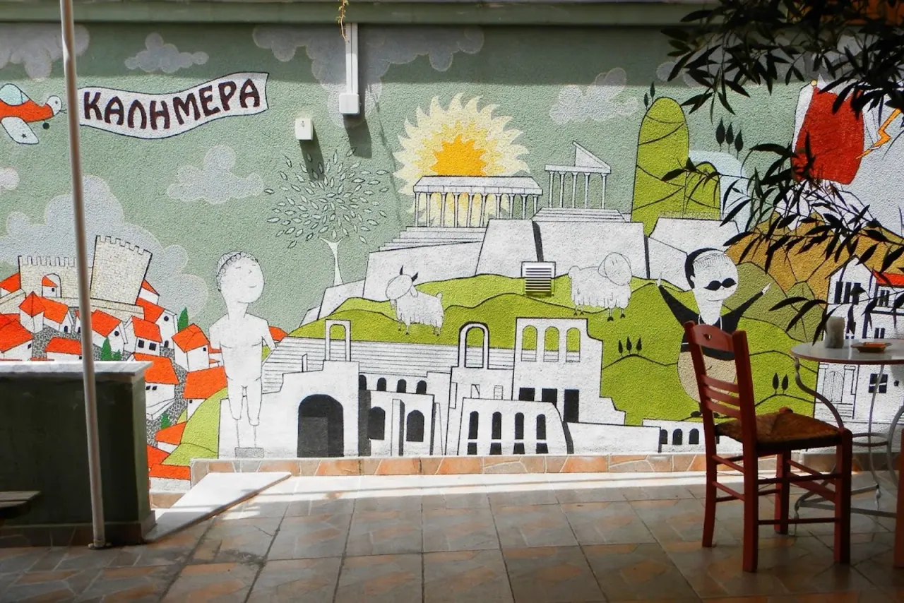 The colourful courtyard mural of a friendly budget guesthouse in Ano Poli, Thessaloniki