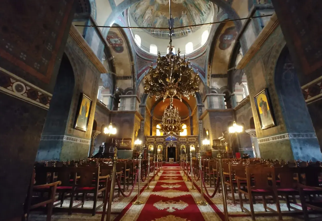 The domed nave of Hagia Sophia in Thessaloniki, the aisle leading to the apse beneath the mosaic dome