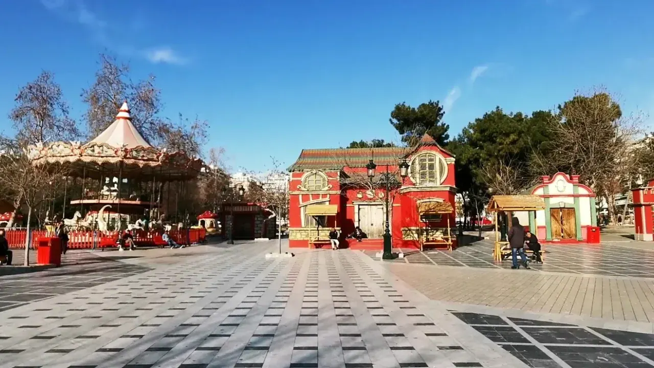 The Christmas market with its carousel and festive red kiosks on Aristotelous Square, Thessaloniki