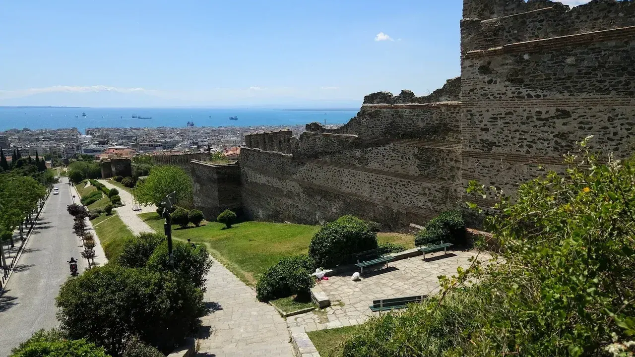 A view over the rooftops of Thessaloniki toward the Thermaic Gulf and the mountains beyond, from the Byzantine walls