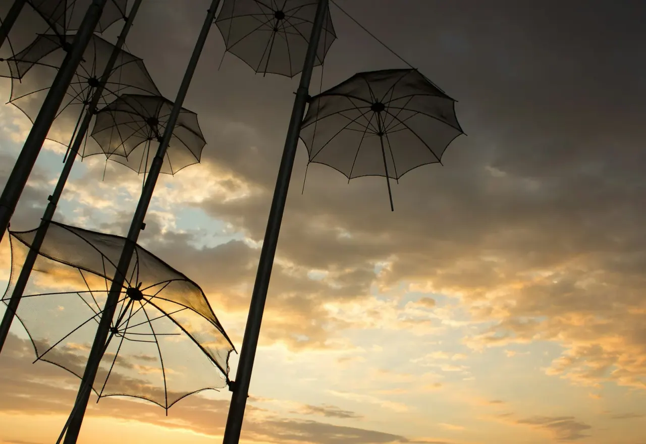 The Umbrellas sculpture on the Thessaloniki waterfront at sunset