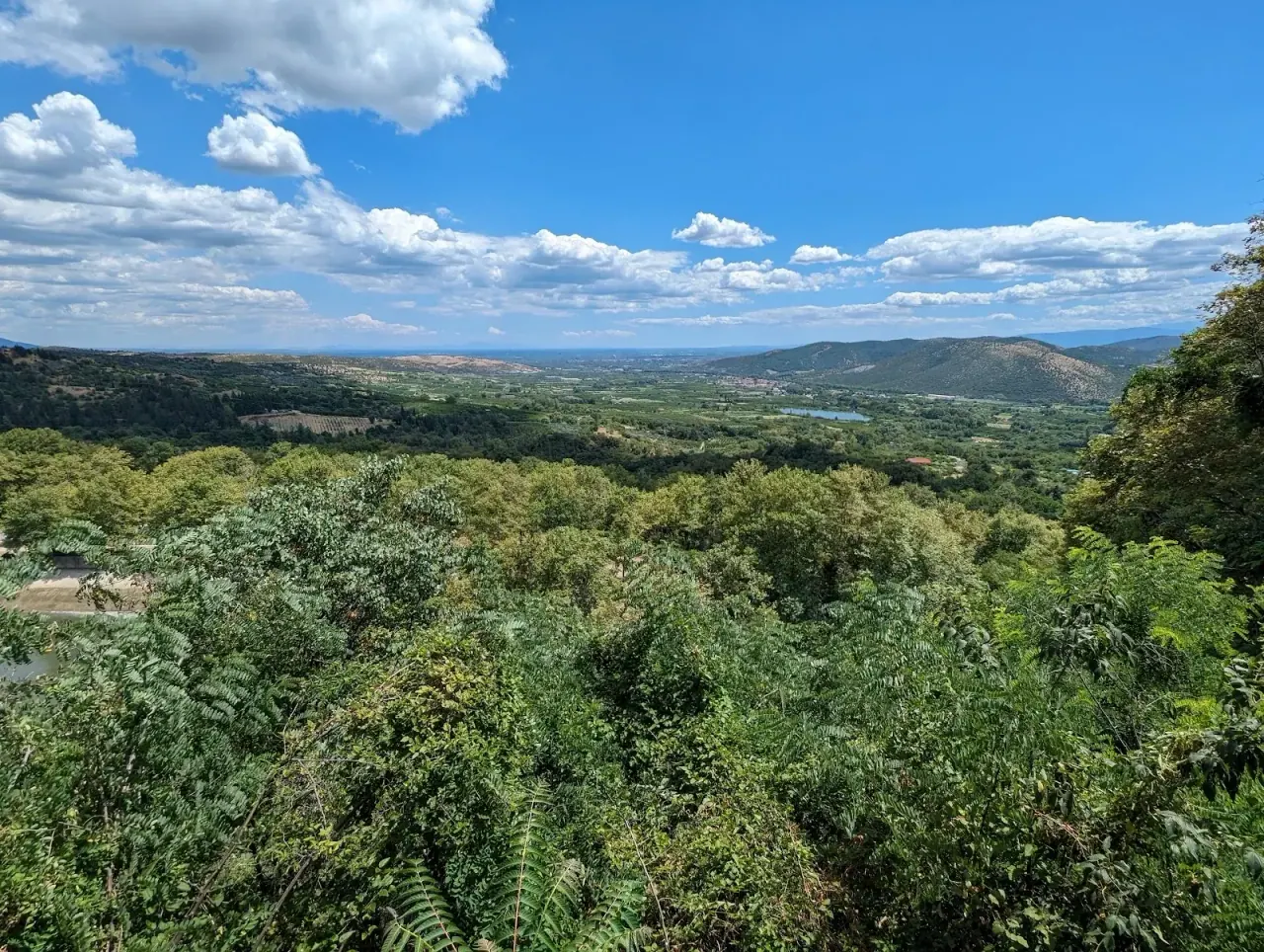 Panorama of the green Macedonian plain seen from the clifftop at Edessa