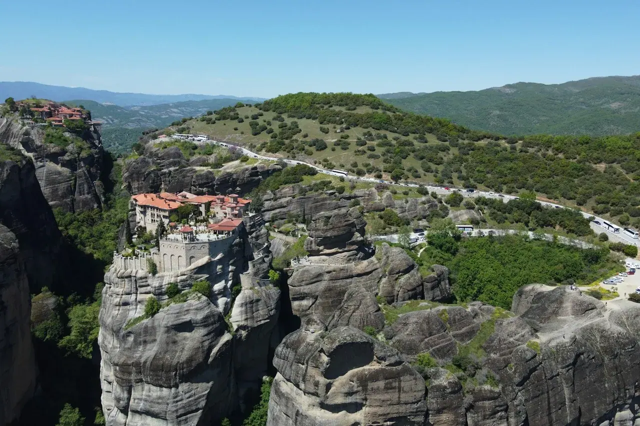 Aerial view of several Meteora monasteries scattered across the sandstone rocks