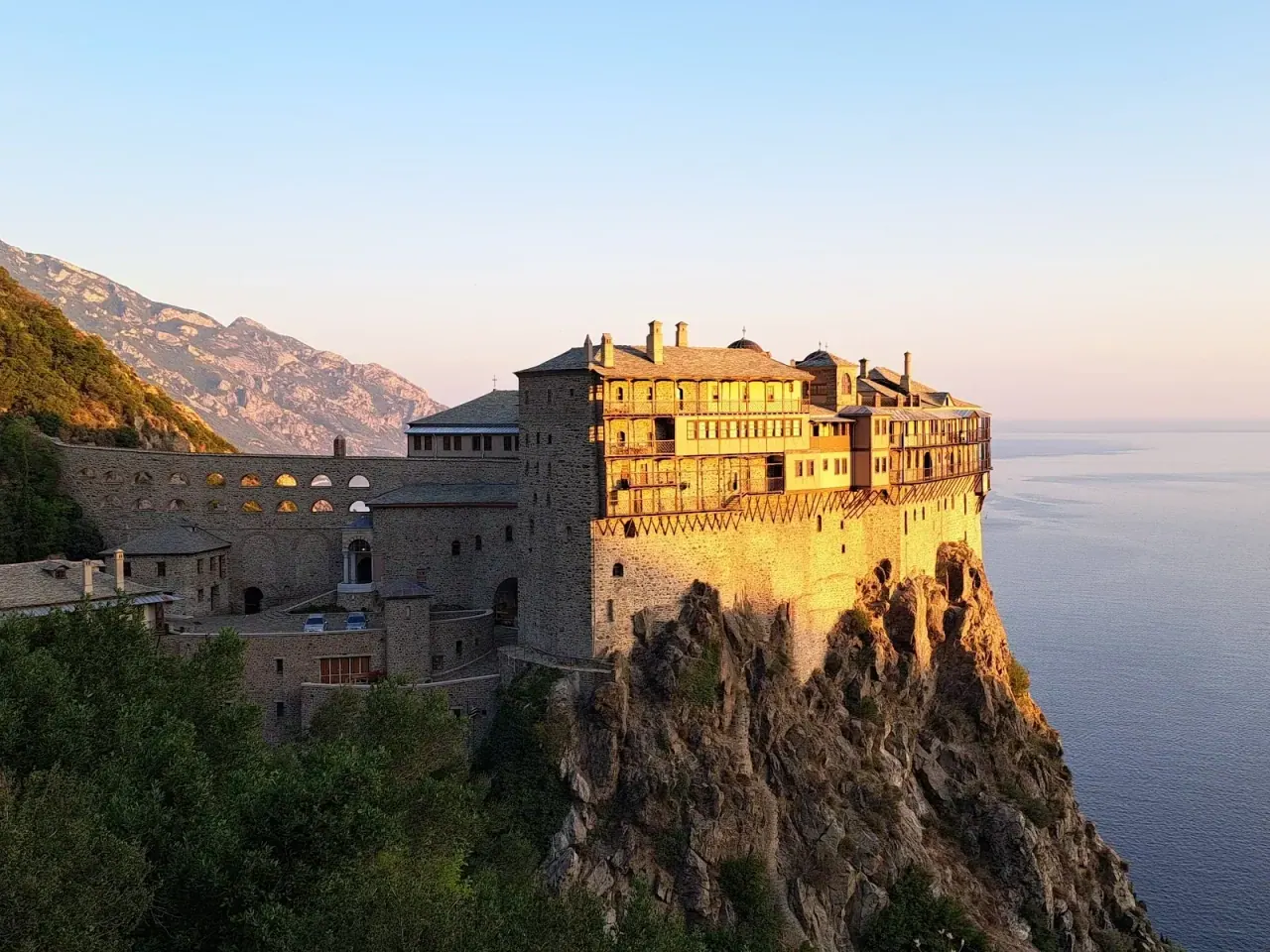A fortified monastery perched on a clifftop above the sea on Mount Athos