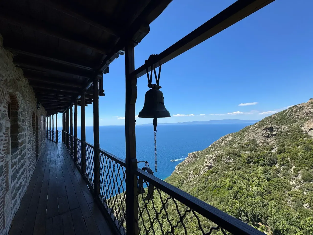 A bell-lined monastery loggia on Mount Athos looking out over the sea