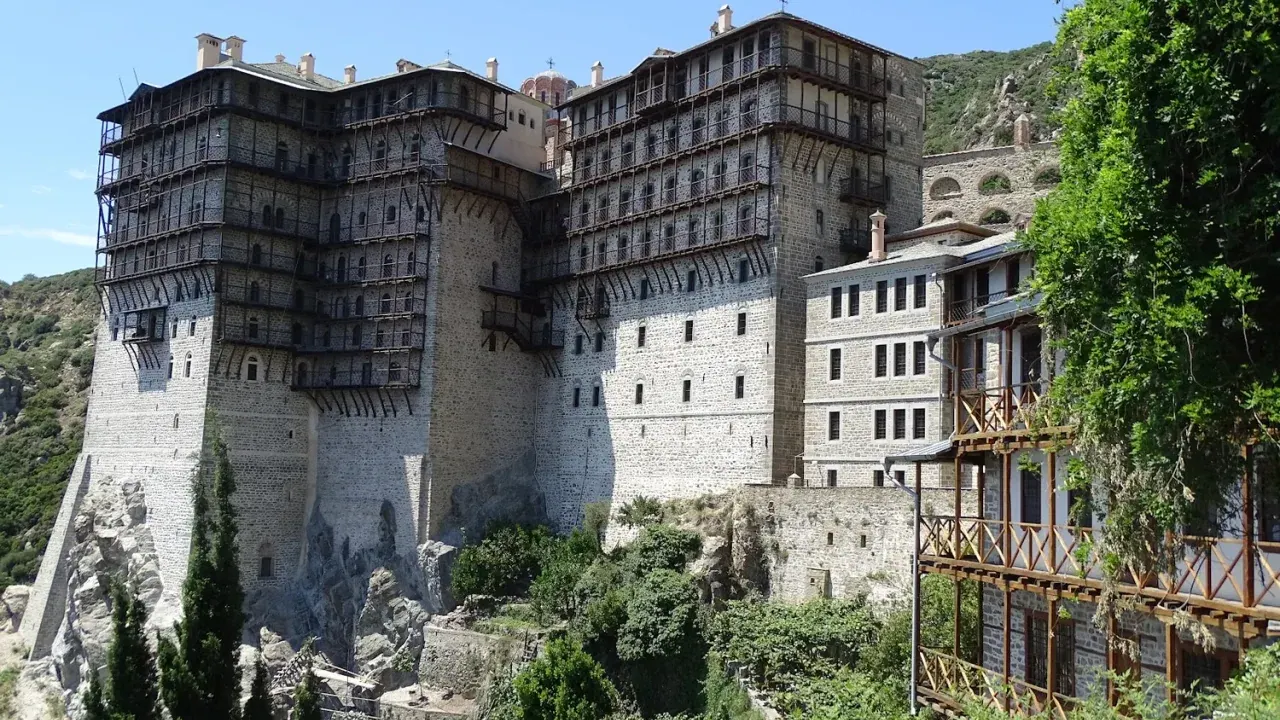 The cliff-perched Simonopetra monastery on Mount Athos rising above the forested slopes