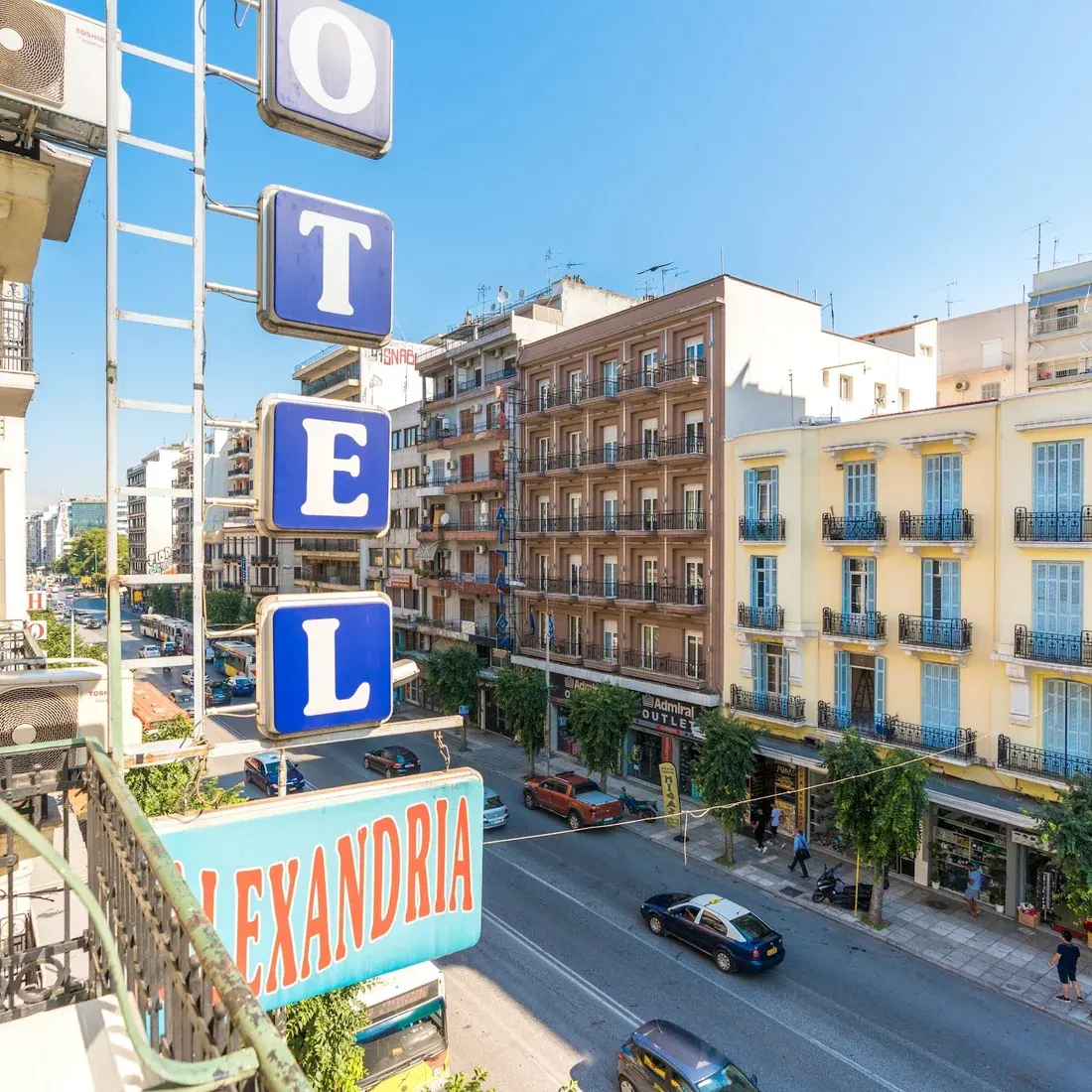 The blue vertical ALEXANDRIA hotel sign above Egnatia Street in central Thessaloniki