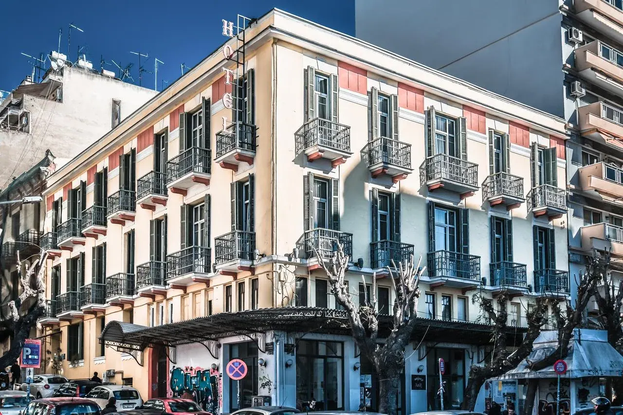 Corner facade of the Orestias Kastorias hotel with its vertical HOTEL sign in central Thessaloniki