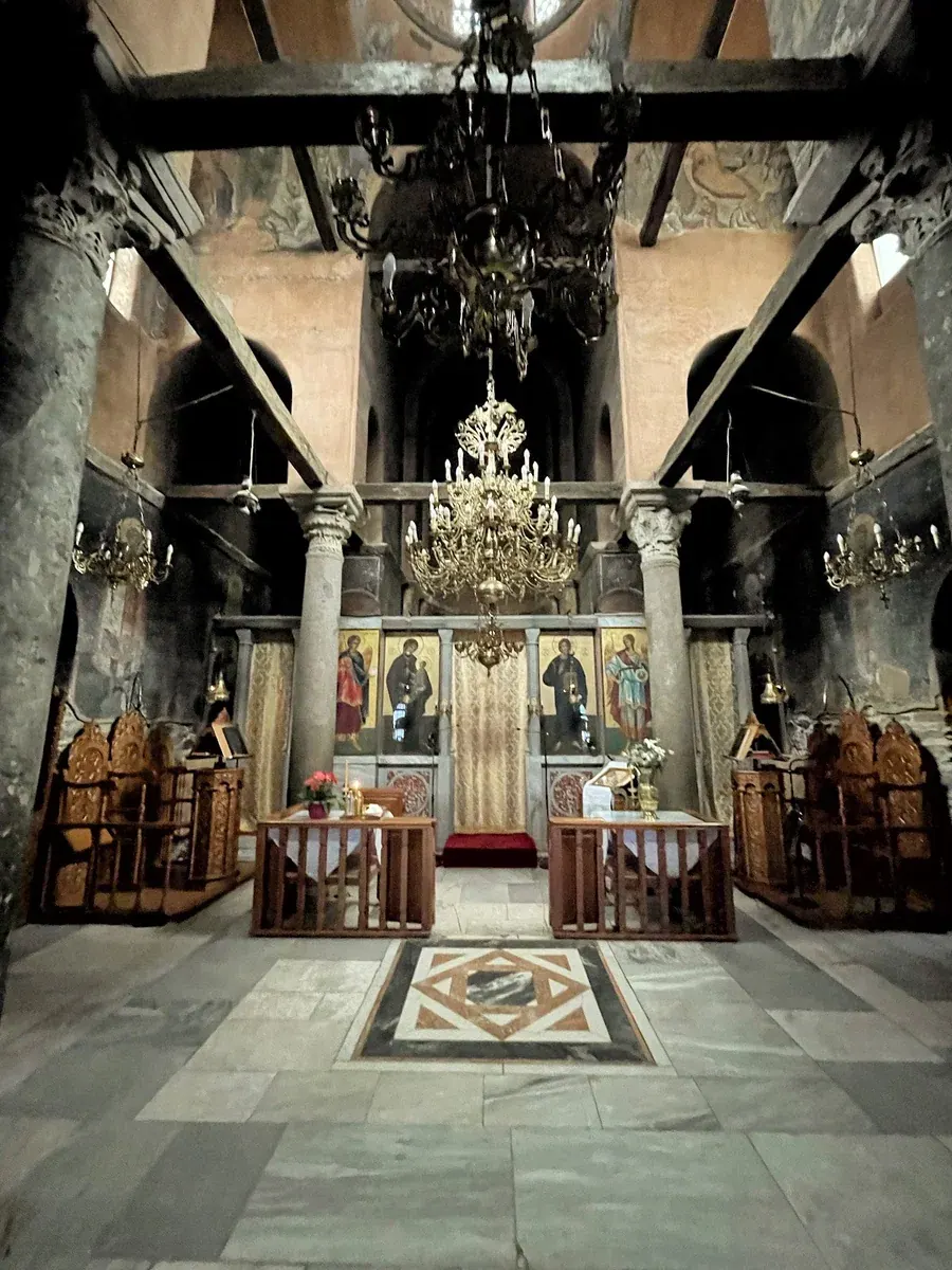 The interior of the Church of the Holy Apostles on ancient columns, looking toward the icon screen and inlaid marble floor, Thessaloniki