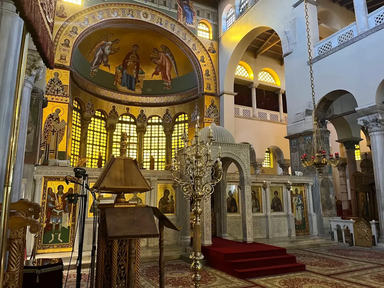 Candlelit Orthodox Easter procession outside a Byzantine church at night