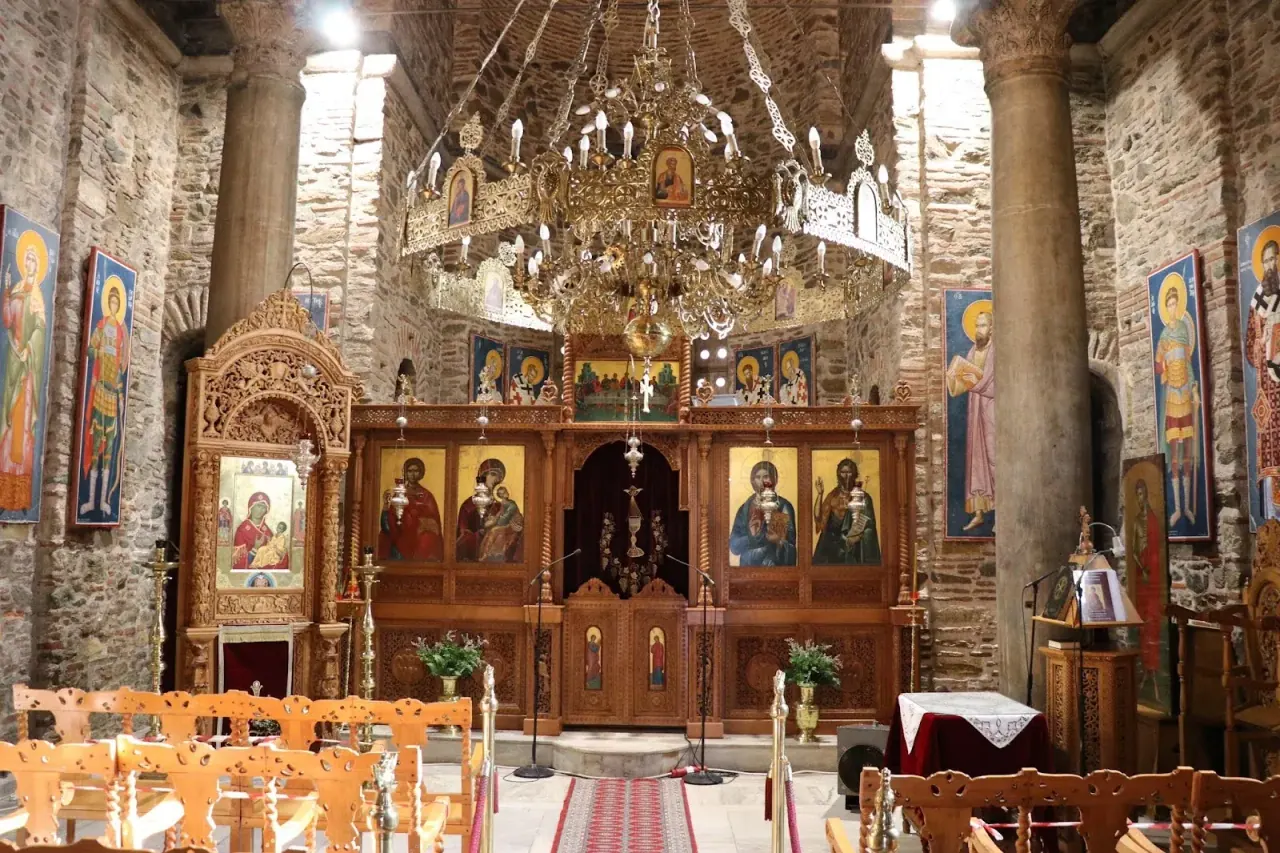 The interior of Agios Panteleimon looking toward the carved icon screen beneath the chandelier, Thessaloniki