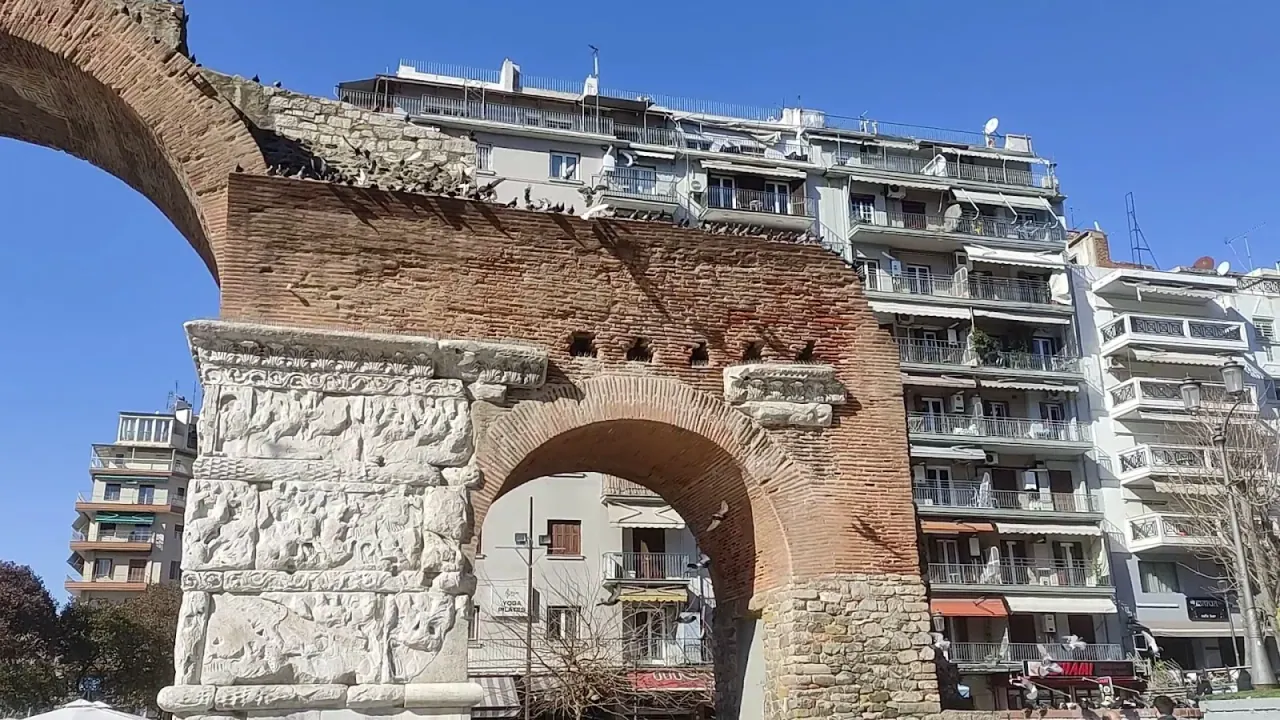 Side view of the Arch of Galerius showing its carved brick pier and standing arch
