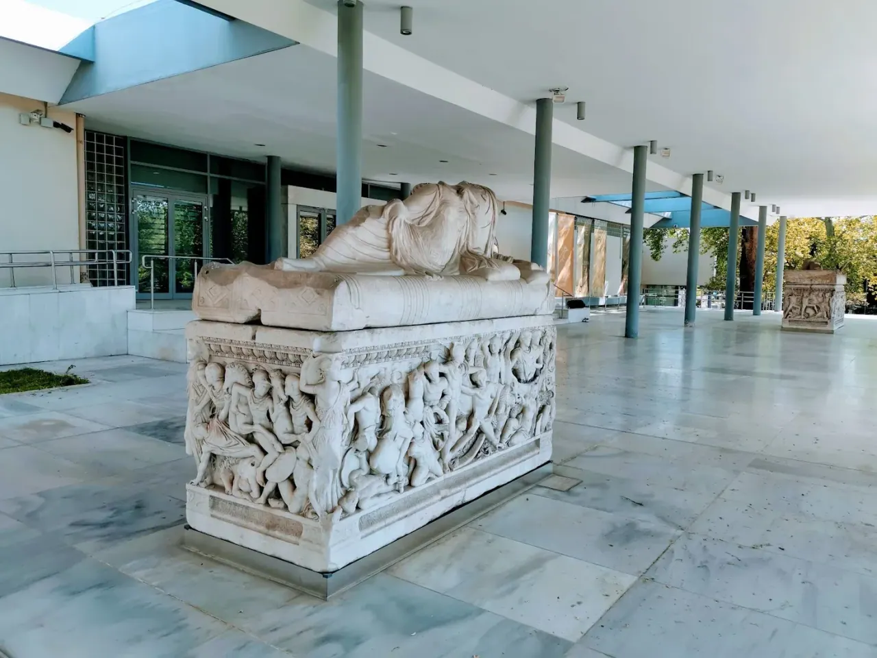 A carved Roman marble sarcophagus on the portico of the Archaeological Museum of Thessaloniki