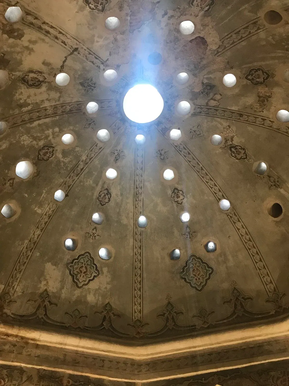 Star-shaped skylights piercing the main dome of the Bey Hamam bathhouse, Thessaloniki