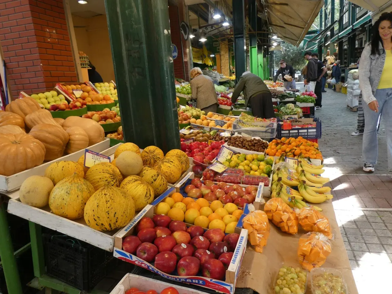 A grocer's stall piled with fresh fruit and vegetables in the Kapani market, Thessaloniki