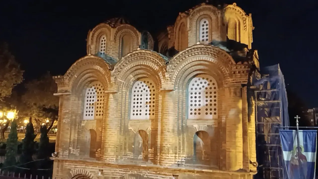 The ornate red-brick exterior and domes of the 11th-century Panagia Chalkeon church, Thessaloniki