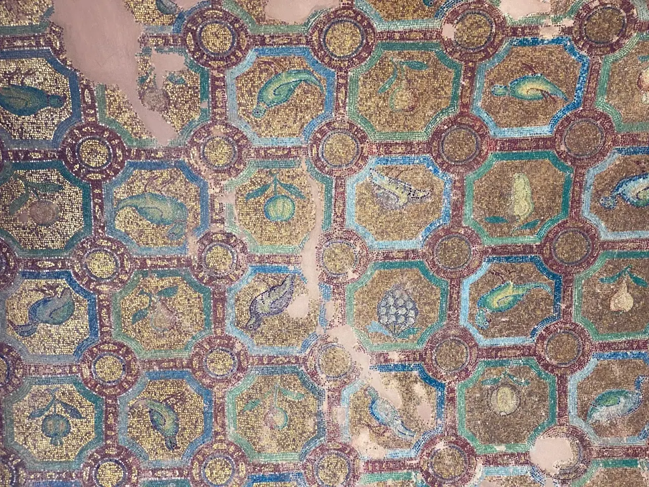 The geometric gold and coloured mosaic ceiling of the Rotunda of Thessaloniki