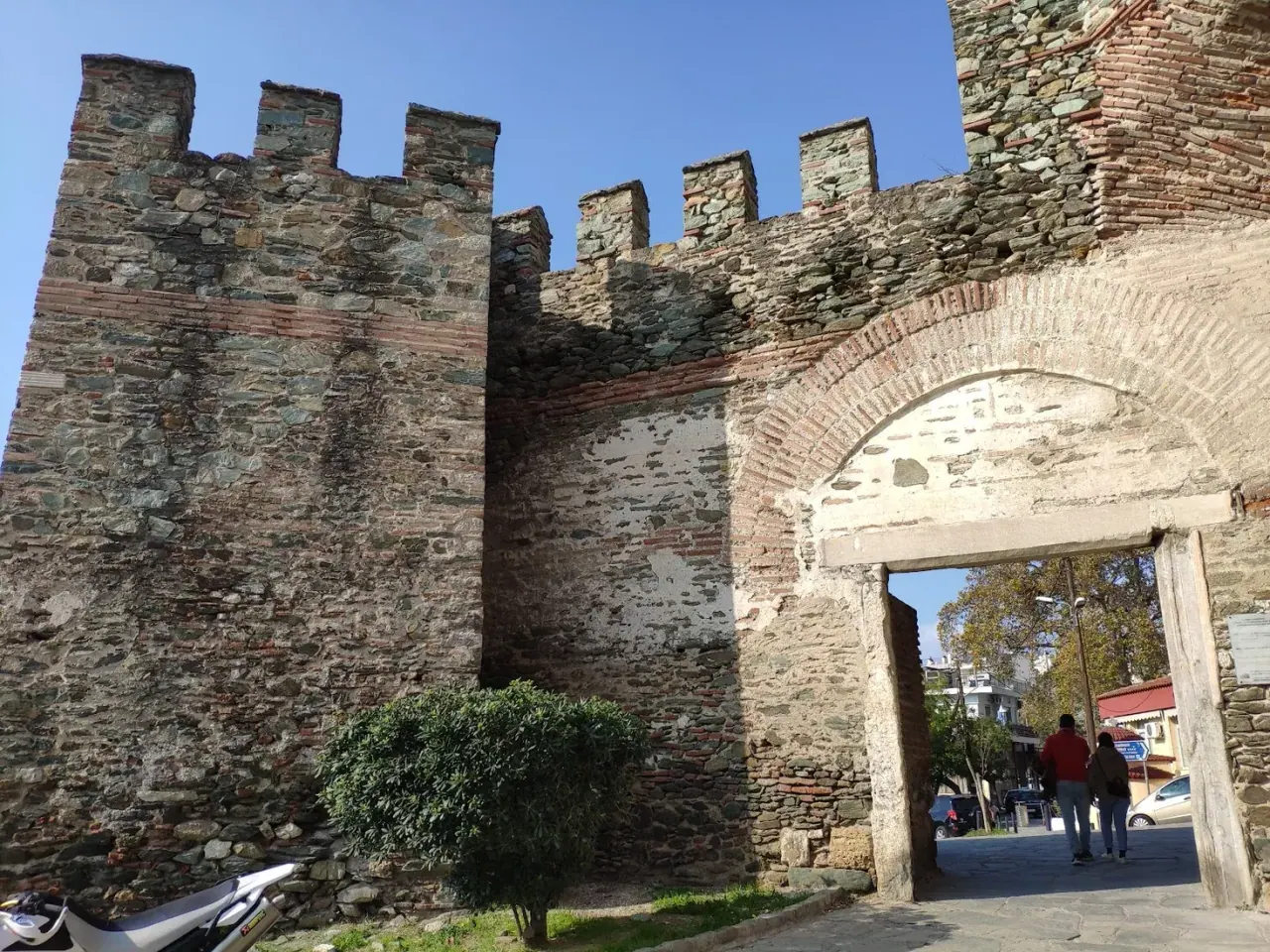 Crenellated ramparts and an arched gate of the Byzantine walls beside the Trigonion Tower