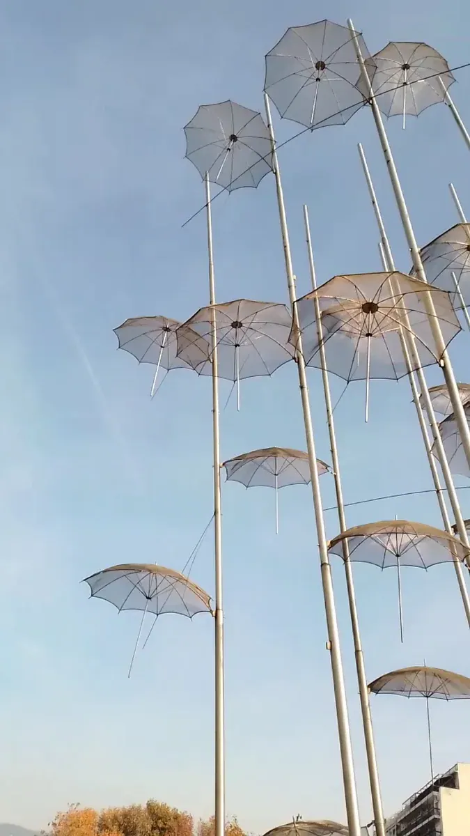 The Umbrellas of Zongolopoulos seen from below against a clear blue sky on the Thessaloniki waterfront