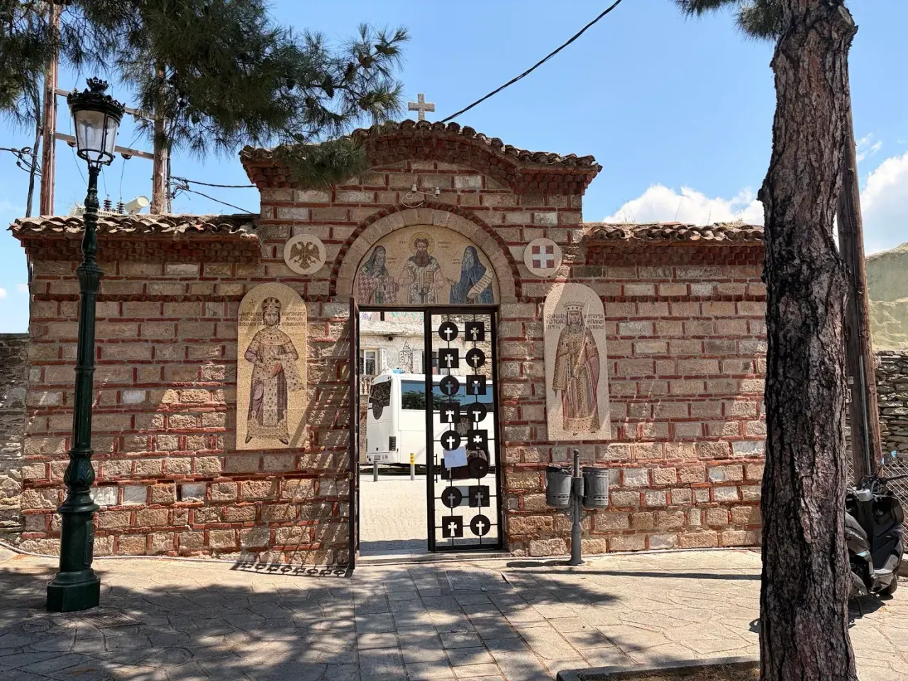 The stone gateway of Vlatadon Monastery with mosaic icons of saints