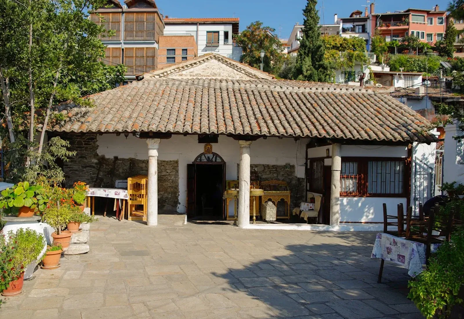 The small tile-roofed church of Osios David in its Ano Poli courtyard, Thessaloniki