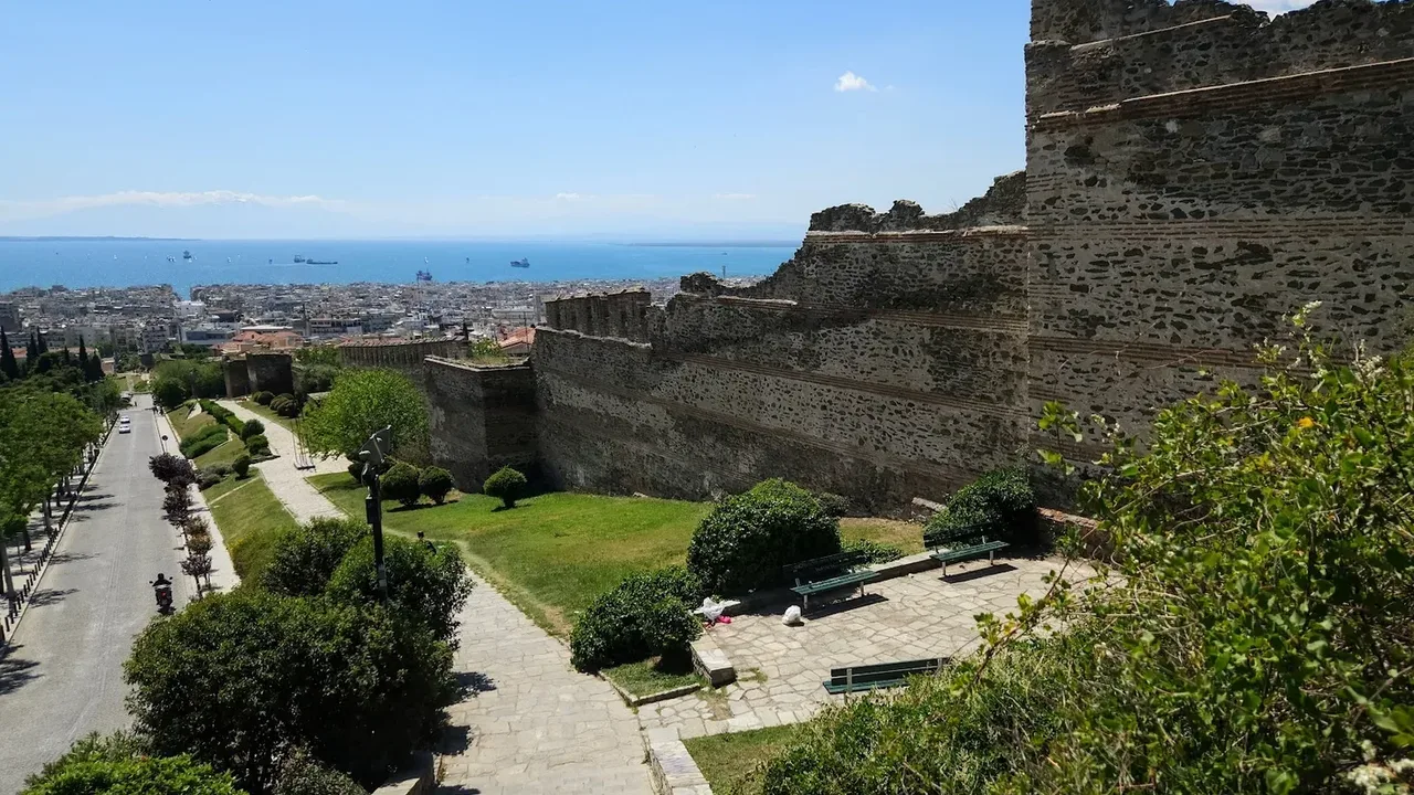 A view over the rooftops of Thessaloniki toward the Thermaic Gulf and the mountains beyond, from the Byzantine walls