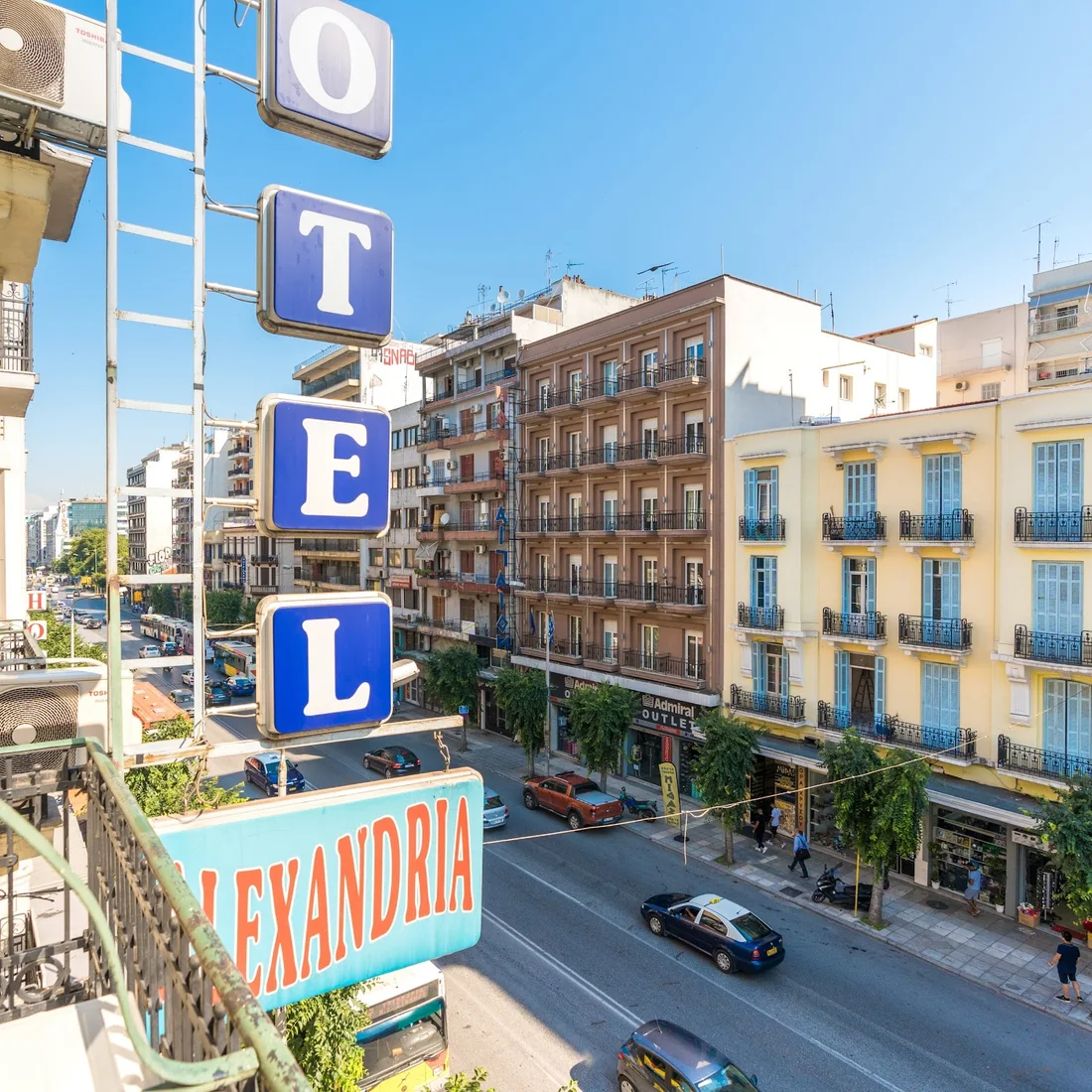 The blue vertical ALEXANDRIA hotel sign above Egnatia Street in central Thessaloniki