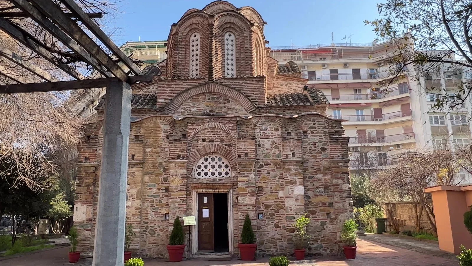 The brick-and-stone Byzantine church of Agios Panteleimon with its central dome, Thessaloniki