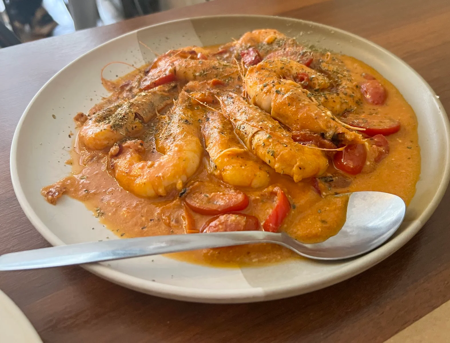 Shrimp saganaki — prawns in a tomato-feta sauce — on a plate at Kanoula taverna, Thessaloniki