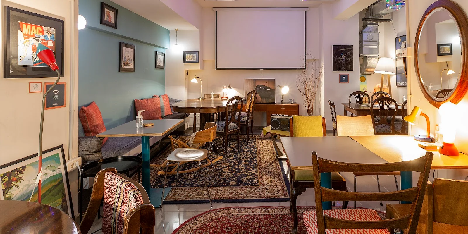 Vintage-styled interior with rugs and framed prints at The Caravan Cafe brunch spot in central Thessaloniki