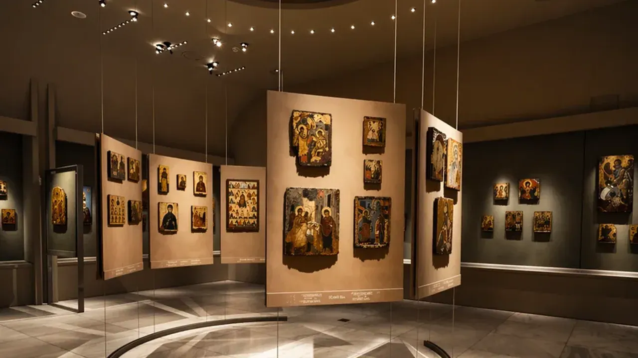 Byzantine icons displayed under dramatic lighting in a hall of the Museum of Byzantine Culture, Thessaloniki