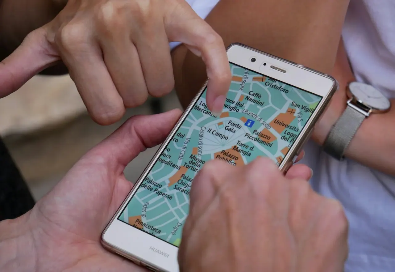 Travellers using a phone map on the go