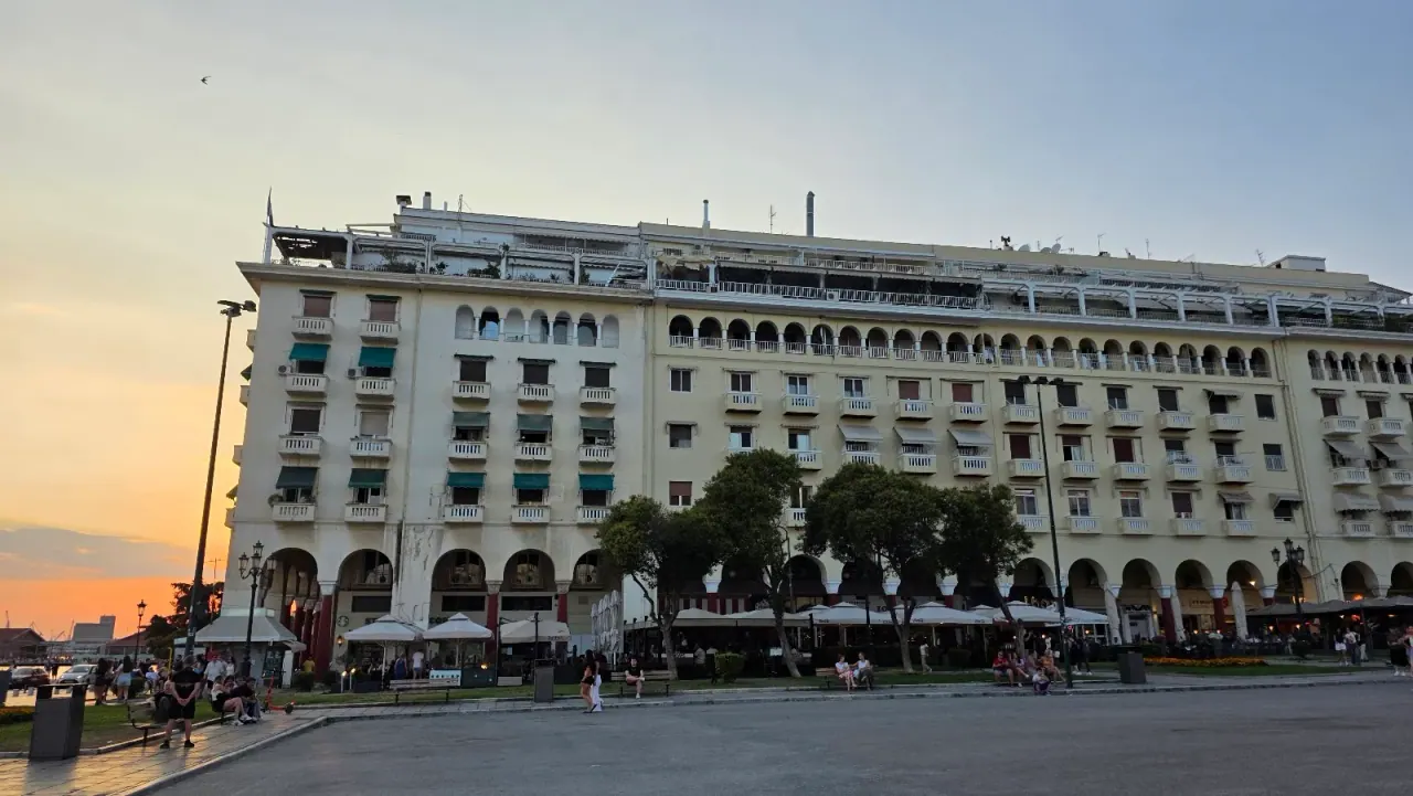 The arcaded Electra Palace facade on Aristotelous Square at sunset, Thessaloniki