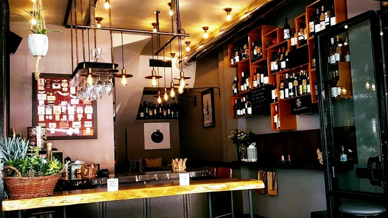 The warm, bottle-lined interior of Souel wine bar near Mitropoleos, Thessaloniki